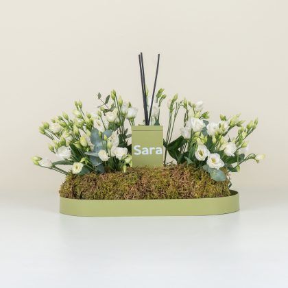 Green diffuser and white flowers