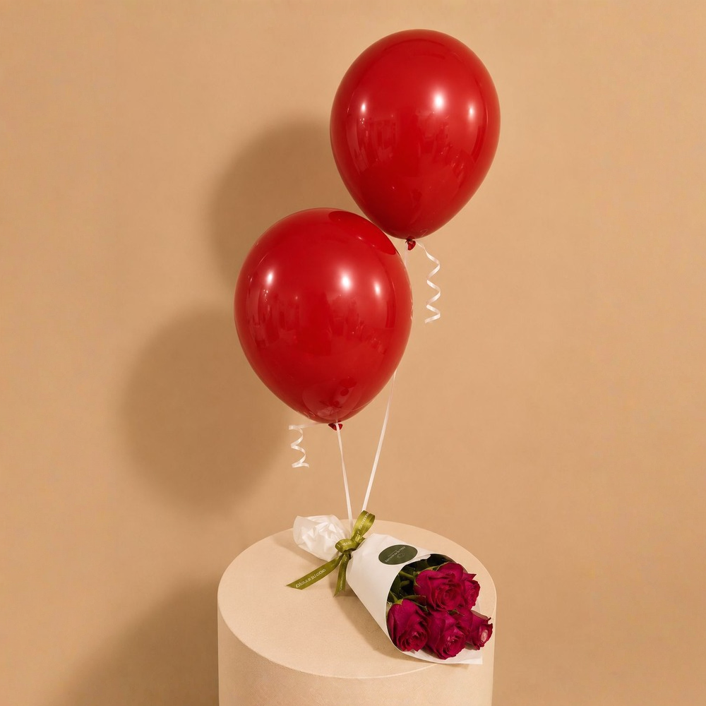 Red petals bouquet with balloons.
